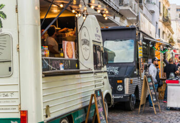 food trucks parked next to each other on a street