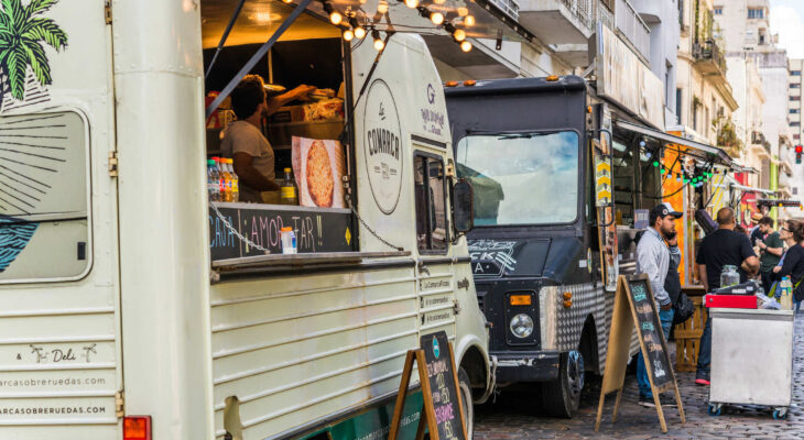 food trucks parked next to each other on a street