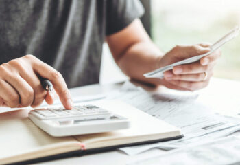 man calculating costs for a food truck business