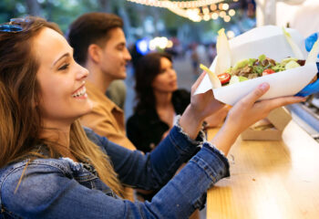 group of friends buying food from a food truck