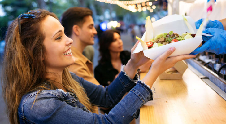 group of friends buying food from a food truck