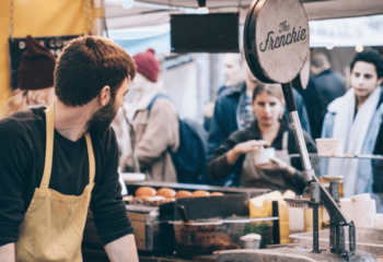 food truck owner serving a number of customers