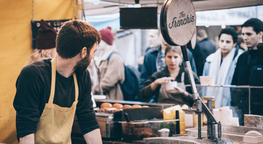 food truck owner serving a number of customers