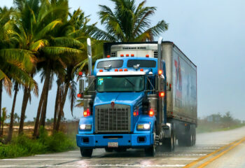 Blue semi-truck on a highway