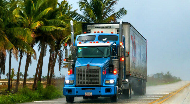 Blue semi-truck on a highway