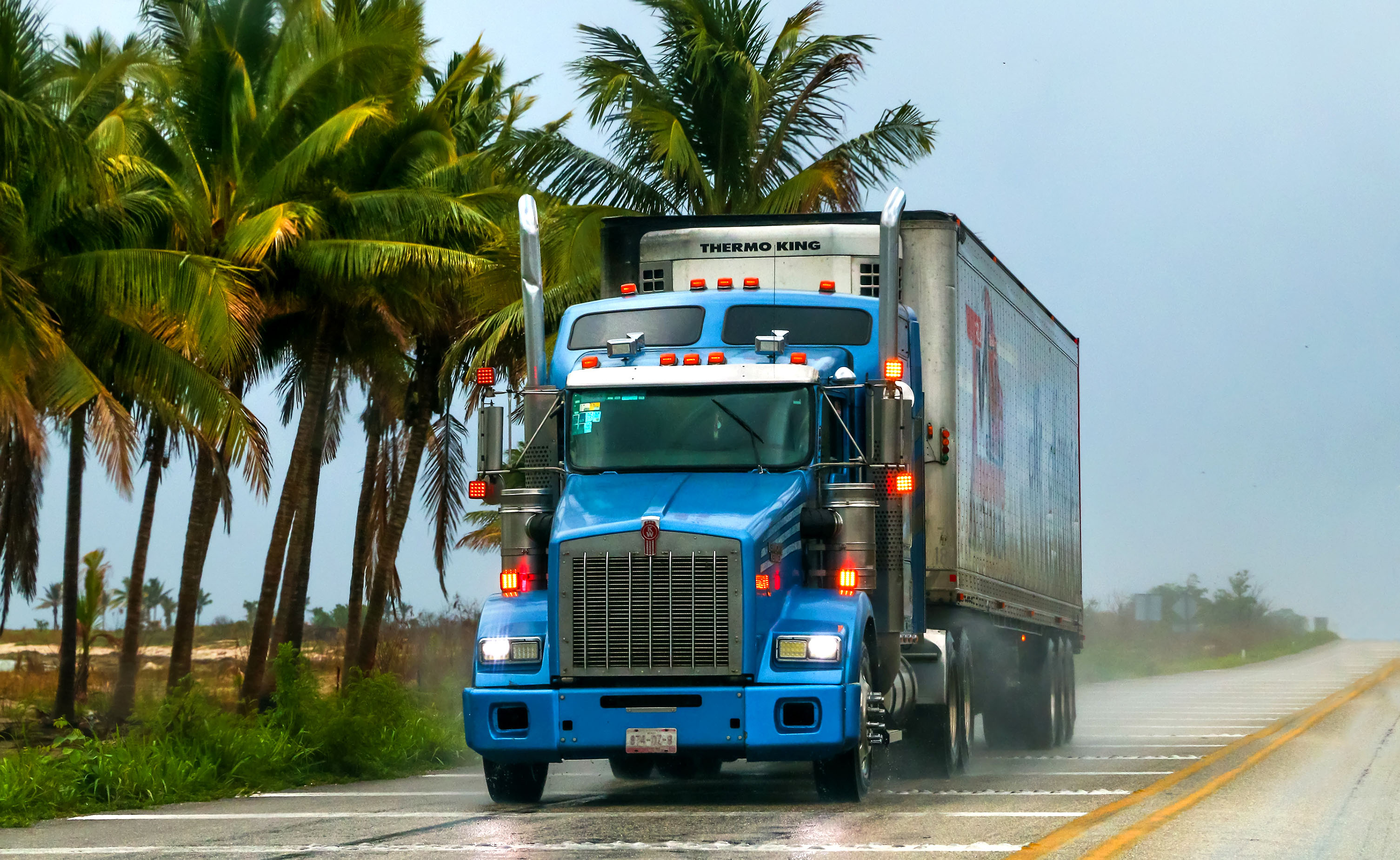 Blue semi-truck on a highway