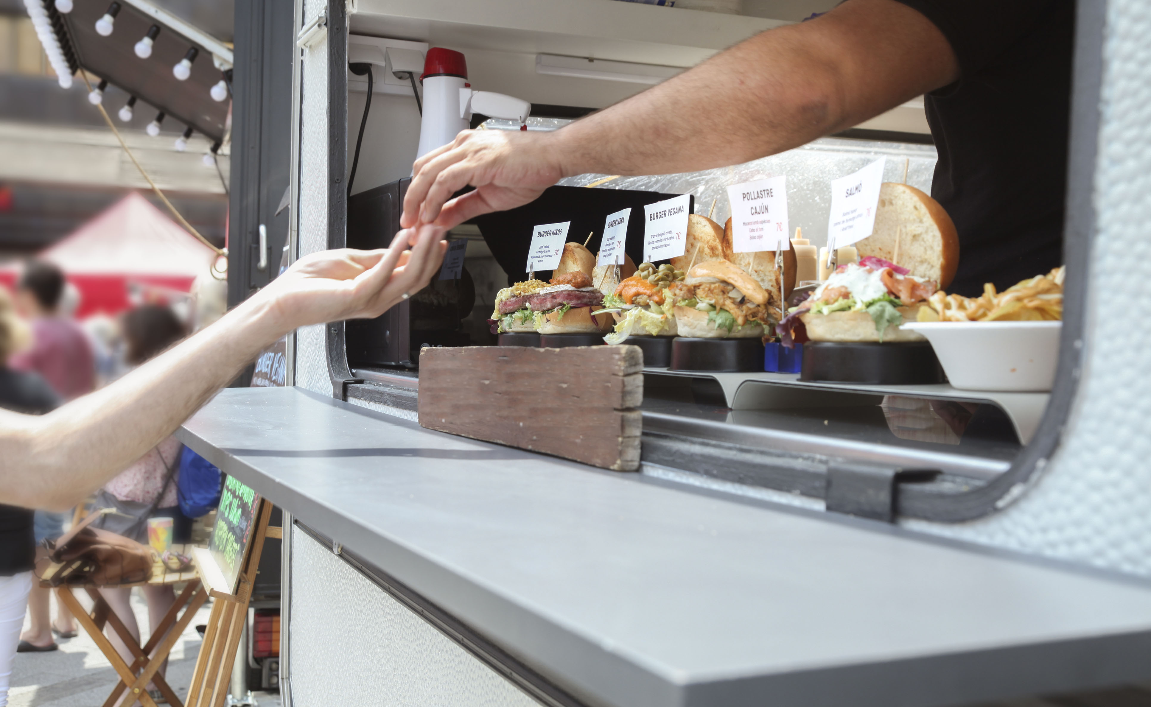 food truck owner handling change to customer