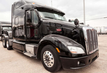 black Peterbilt 587 sleeper truck on a parking lot