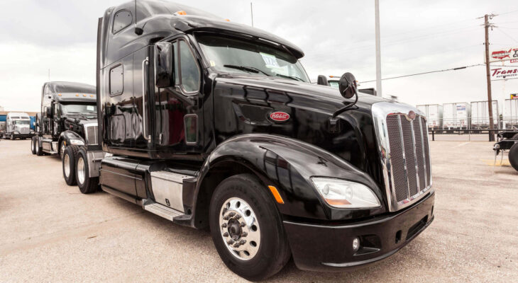 black Peterbilt 587 sleeper truck on a parking lot