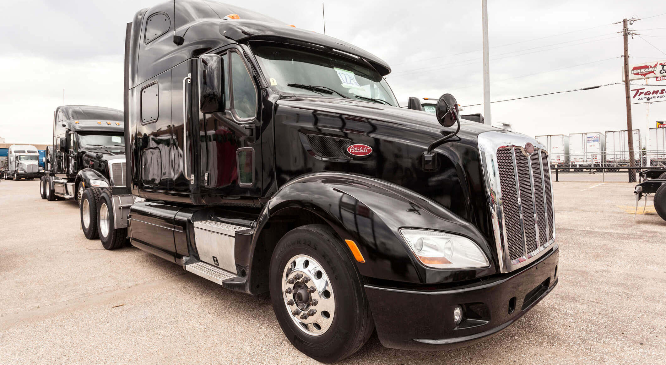 black Peterbilt 587 sleeper truck on a parking lot