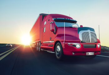 red sleeper truck on the road during sunrise