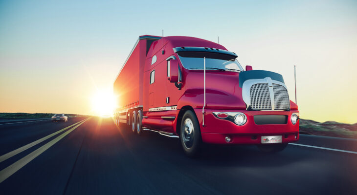 red sleeper truck on the road during sunrise