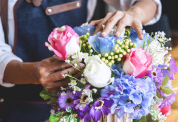 florist arranging a bouquet of flowers