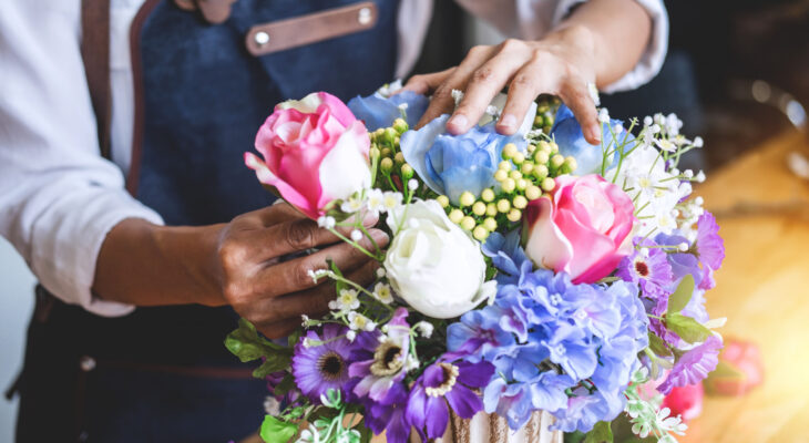 florist arranging a bouquet of flowers