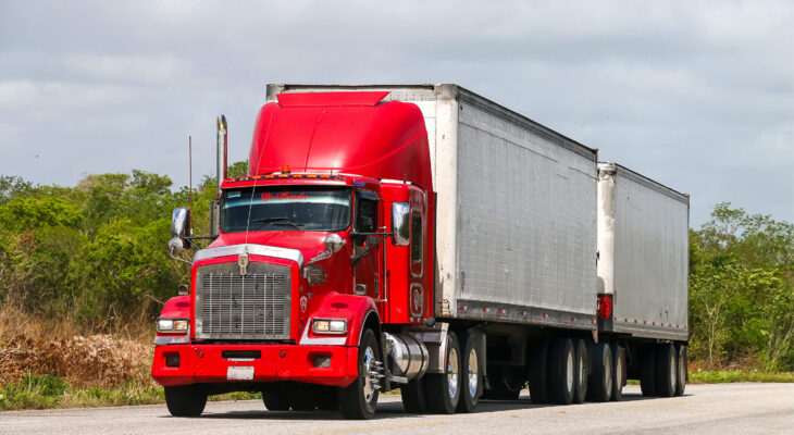 red day cab truck on a highway