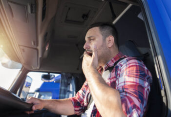 tired sleeper truck driver after a long ride