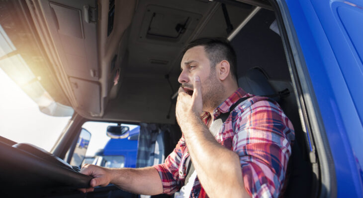 tired sleeper truck driver after a long ride