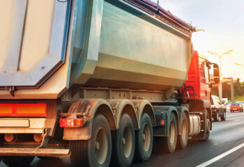 red dump truck on a highway