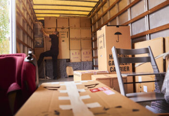 moving truck company helping a family move out of their old home