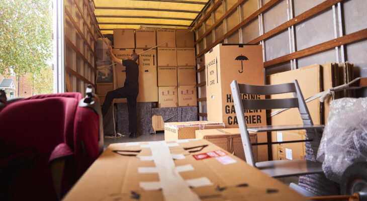 moving truck company helping a family move out of their old home