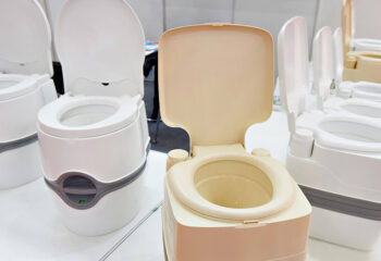 portable toilets for sleeper trucks lined up at a store