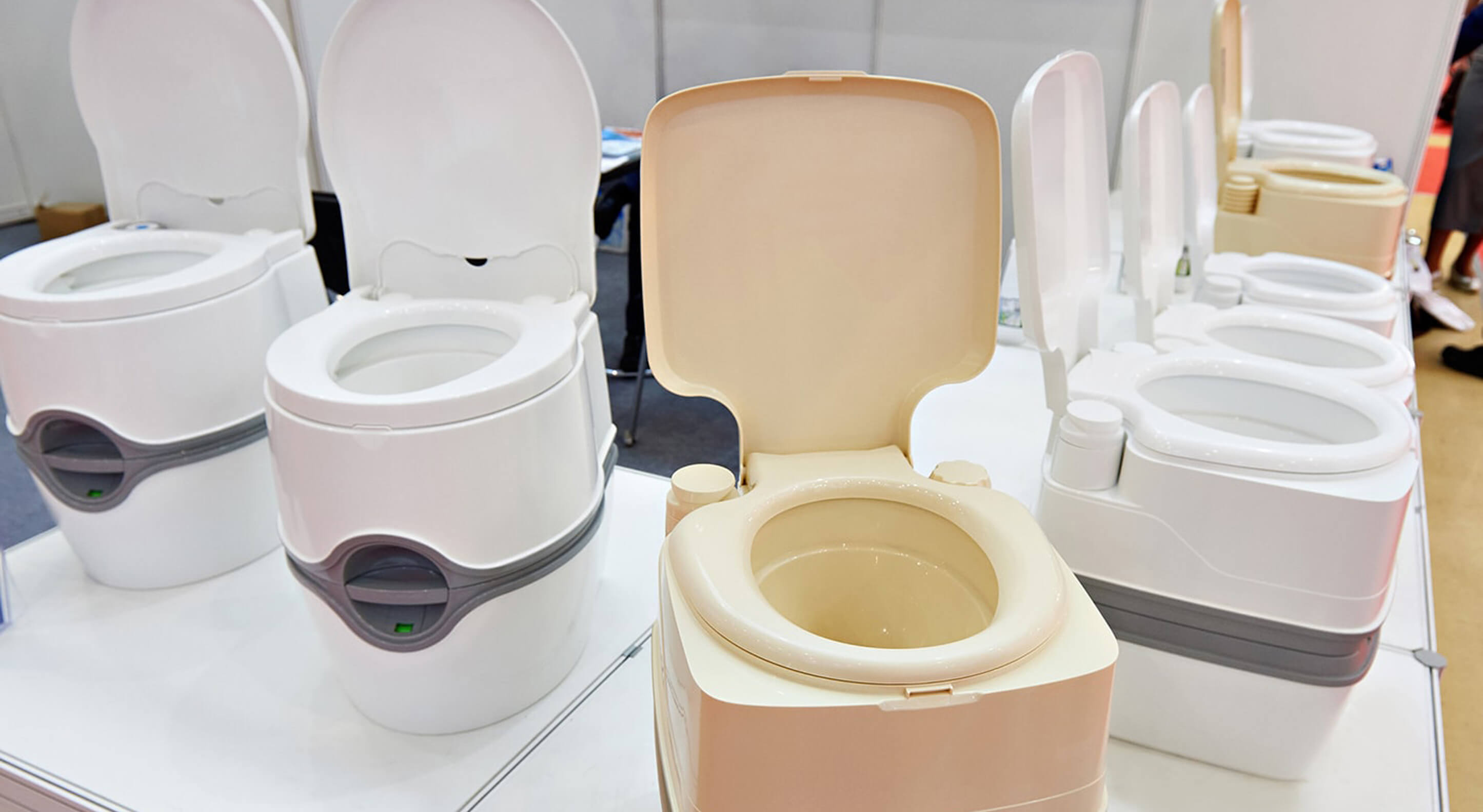 portable toilets for sleeper trucks lined up at a store