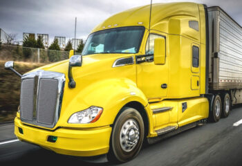 yellow sleeper cab on a highway