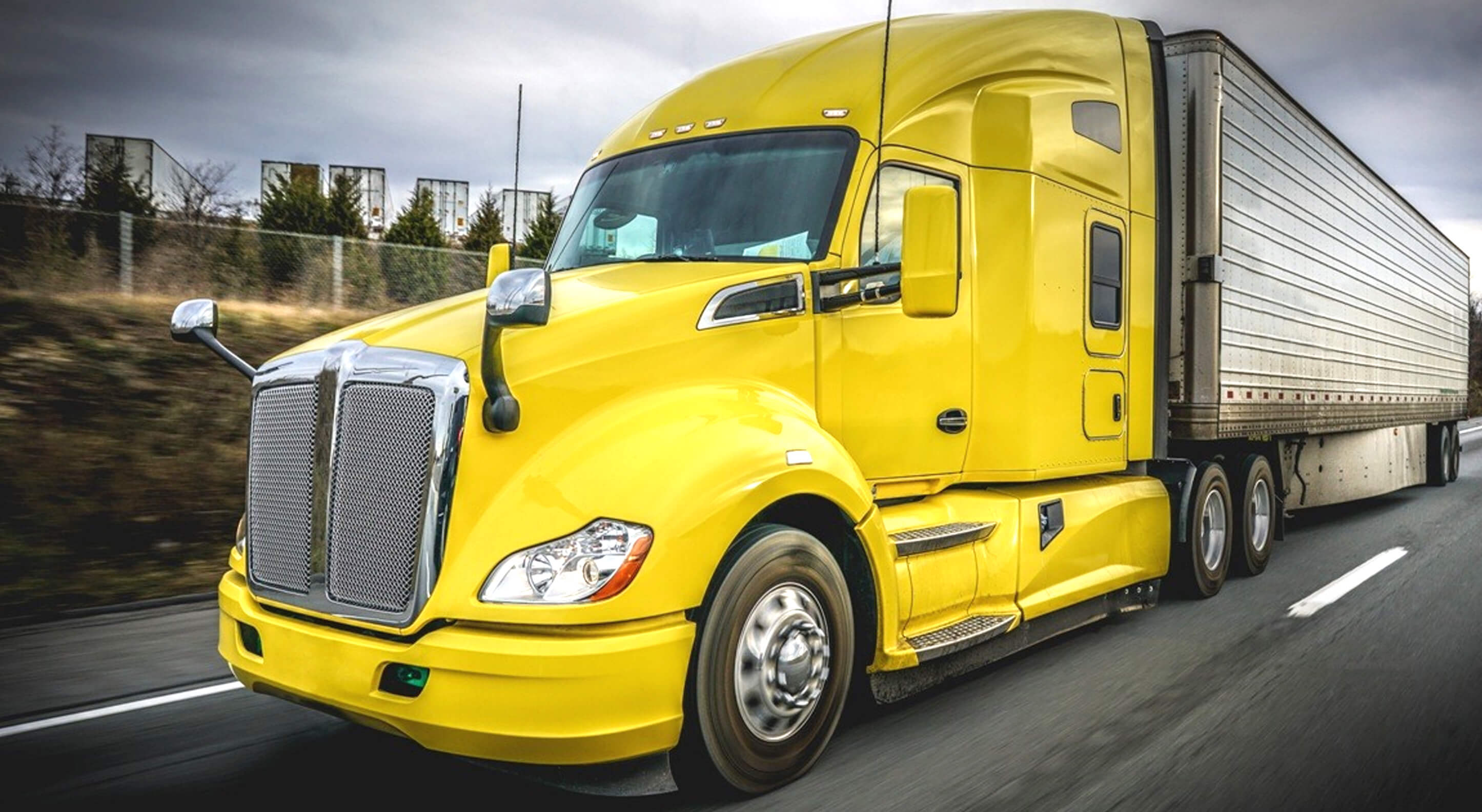 yellow sleeper cab on a highway