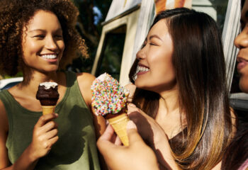 group of three girl friends eating ice cream