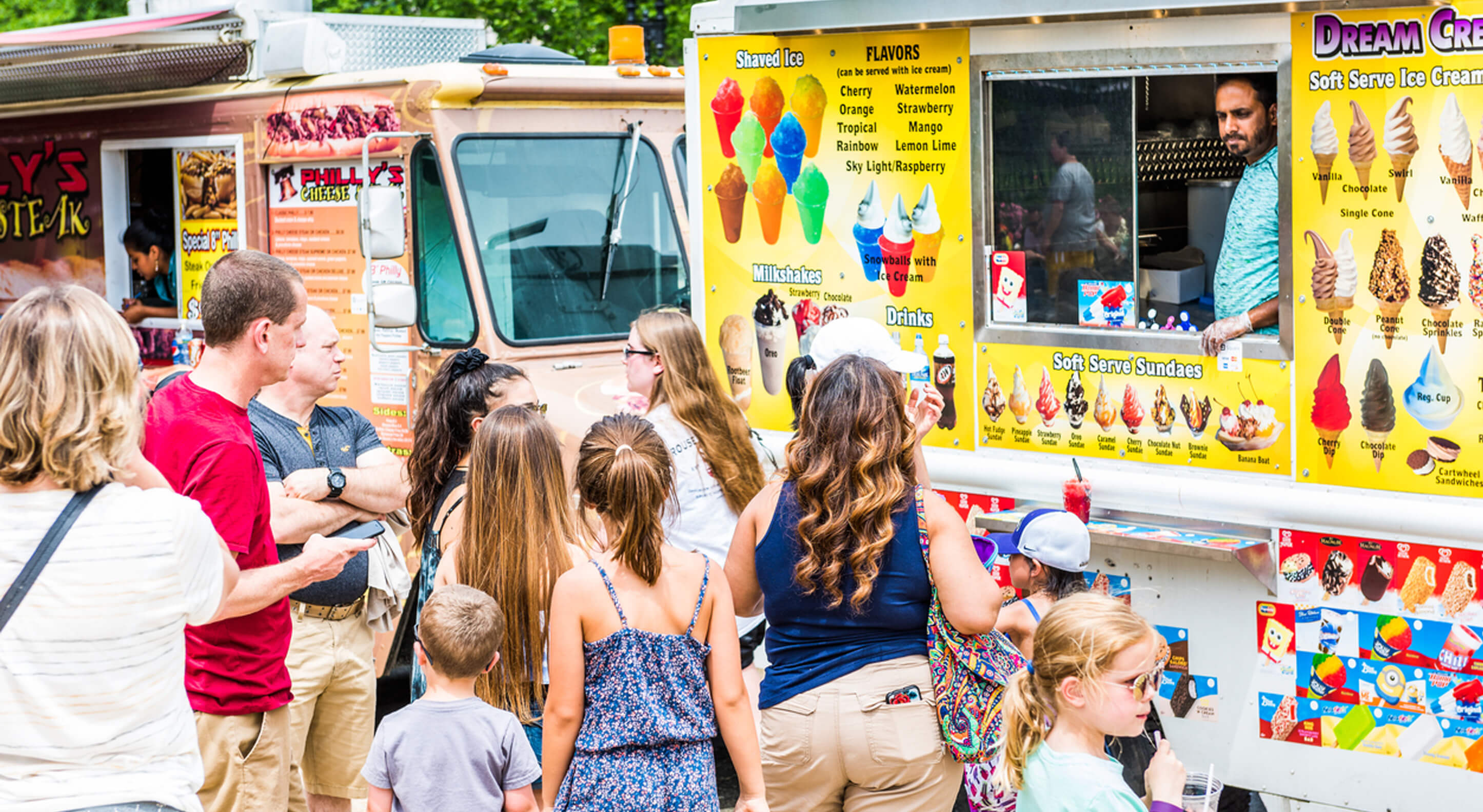 group of people in front of a snowball vtruck