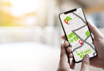 person's hand using a navigation app on a mobile device