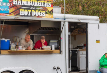 concession trailer owners selling hamburgers and hotdog