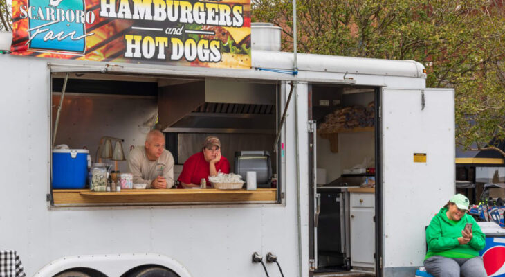 concession trailer owners selling hamburgers and hotdog