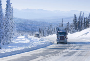 semi-truck driving on Dalton Highway in Alaska