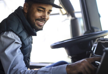 truck driver listening to the radio in his semi truck