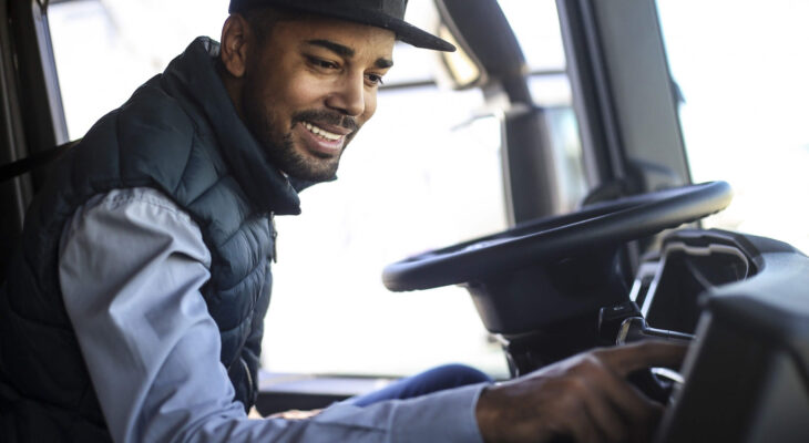 truck driver listening to the radio in his semi truck