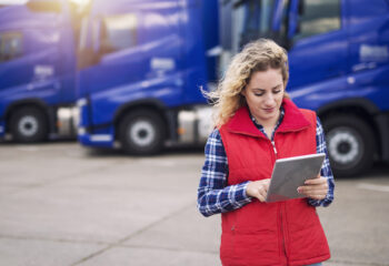 businesswoman looking at her trucking business' financial goals