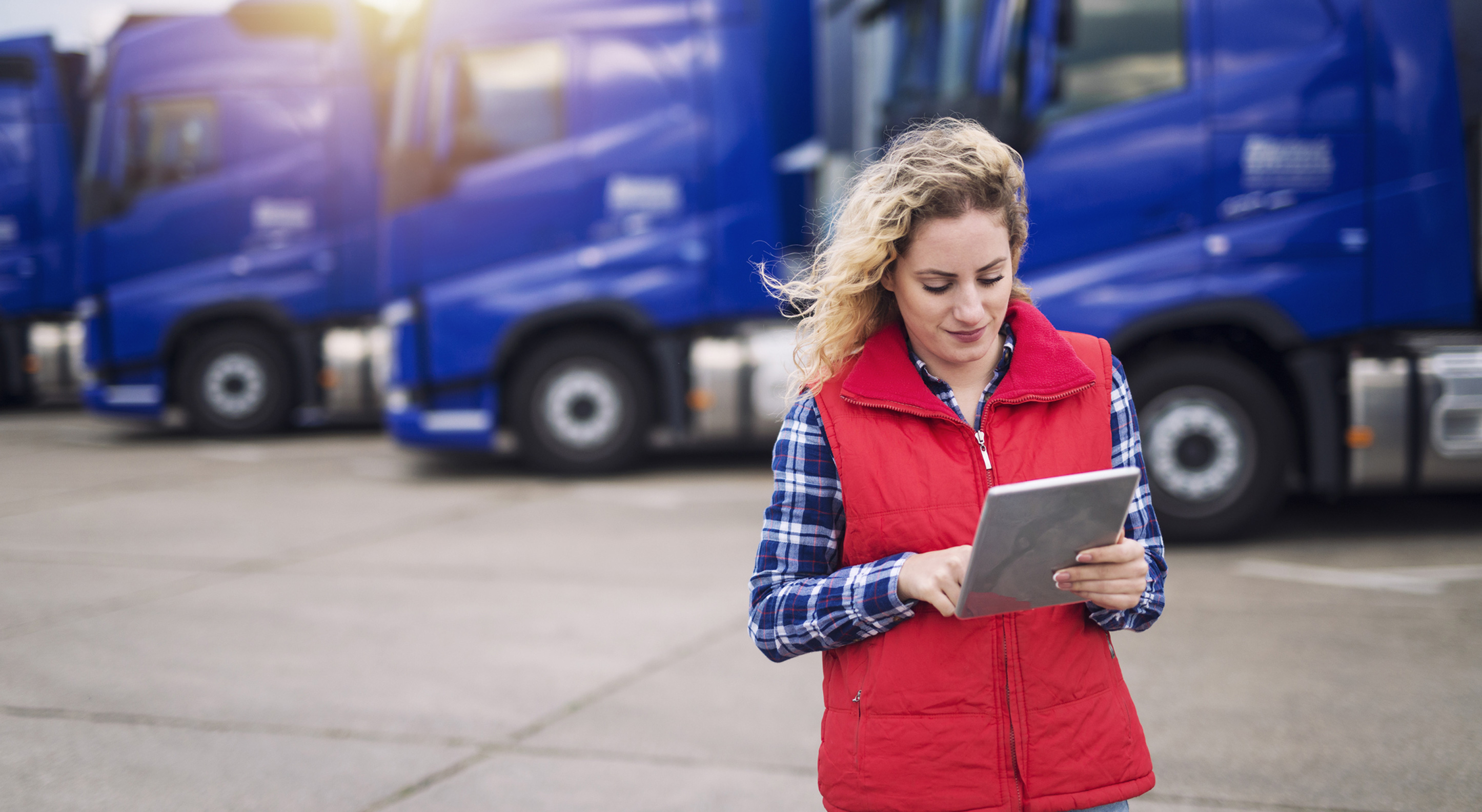 businesswoman looking at her trucking business' financial goals