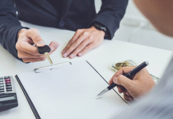 person signing a contract for a truck loan