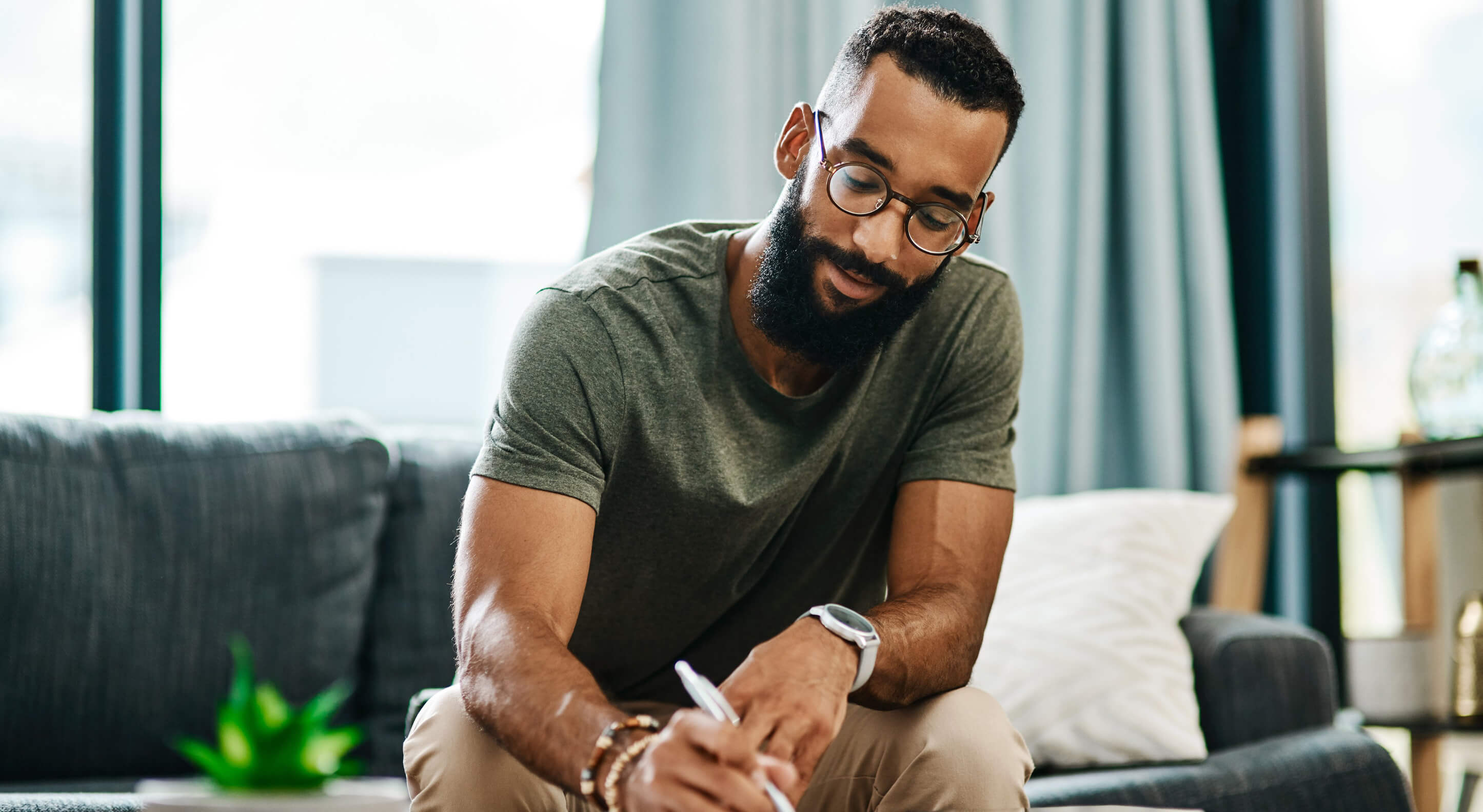 young truck business owner signing business contract at home