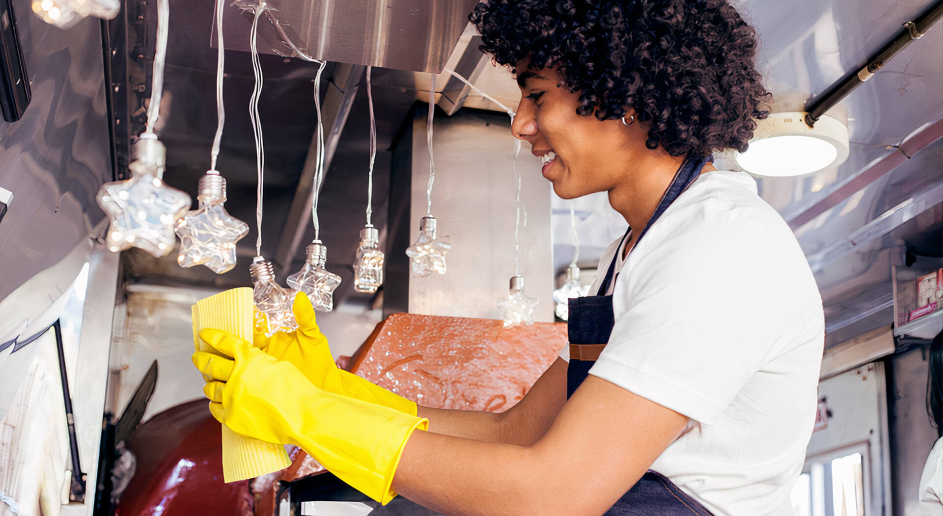 food truck employee cleaning the food truck ornaments