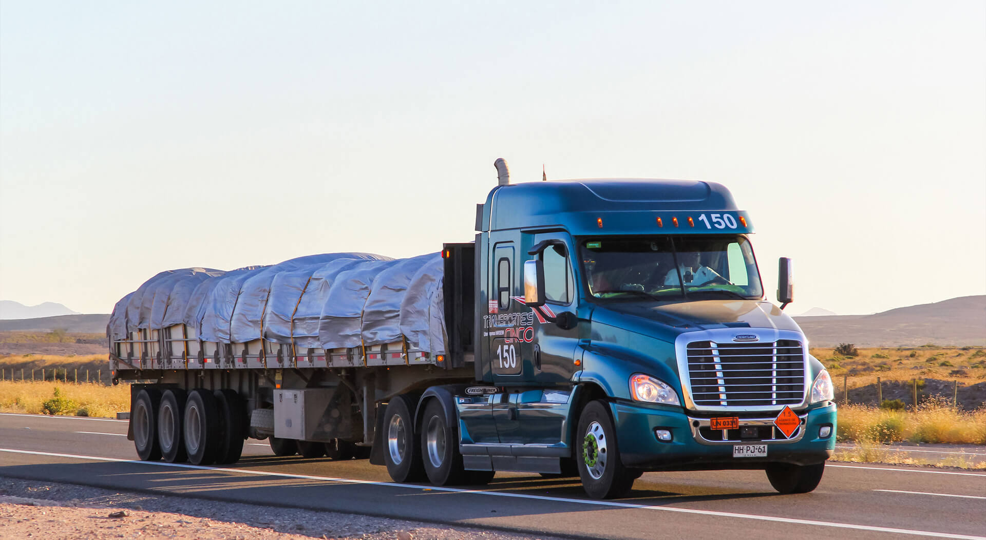 semi-trailer truck Freightliner Cascadia drives at the interurban freeway