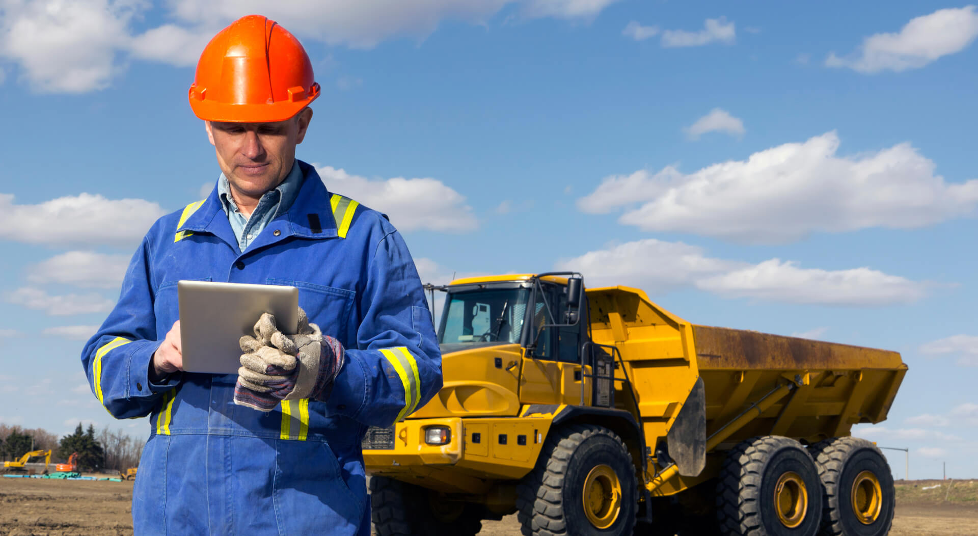 construction worker using a tablet at a construction site