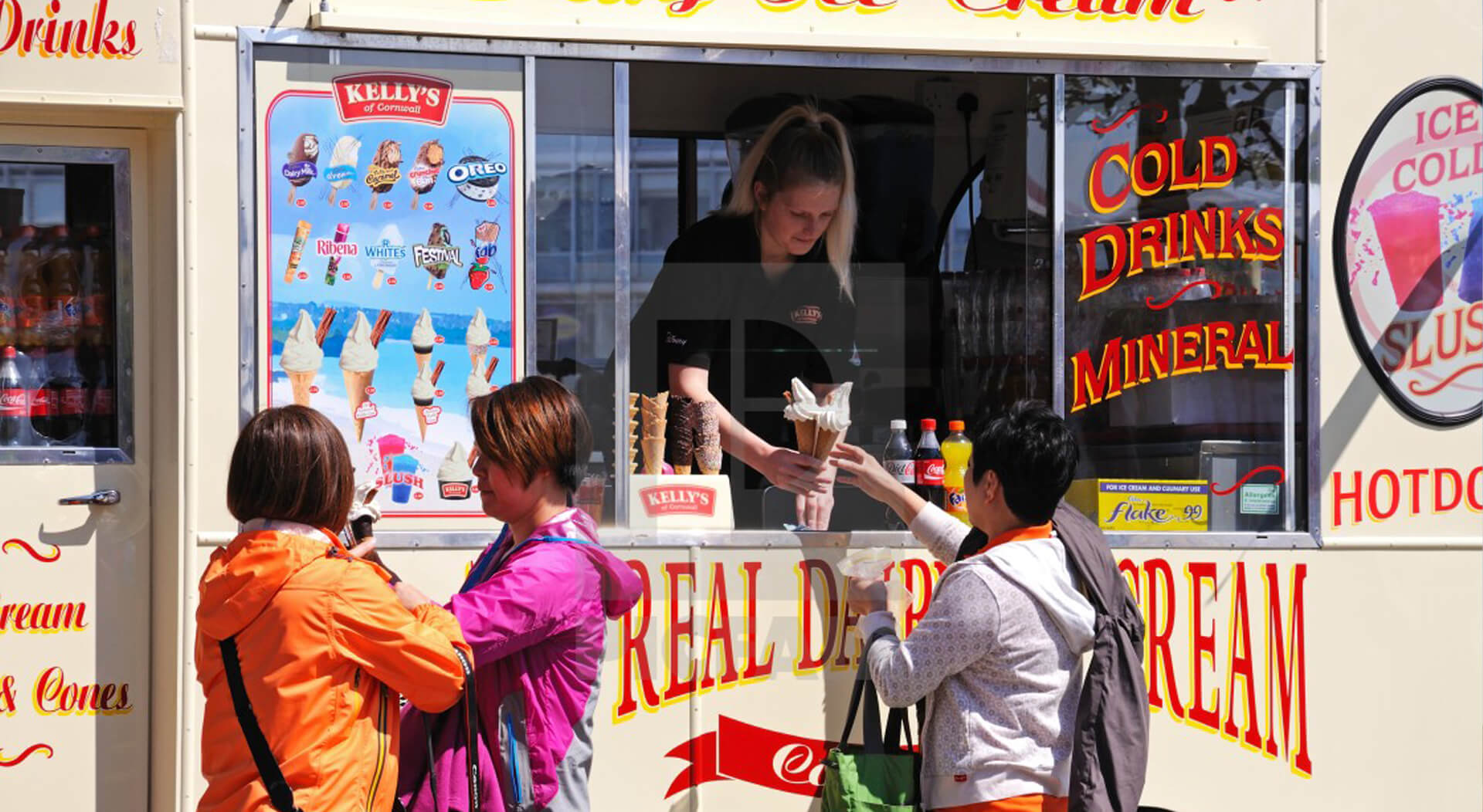 tourists buying ice cream from an ice cream van