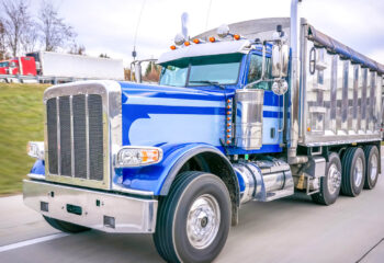 blue dump truck on a highway