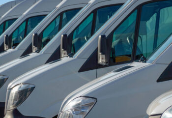 white transport vans are waiting for the next order