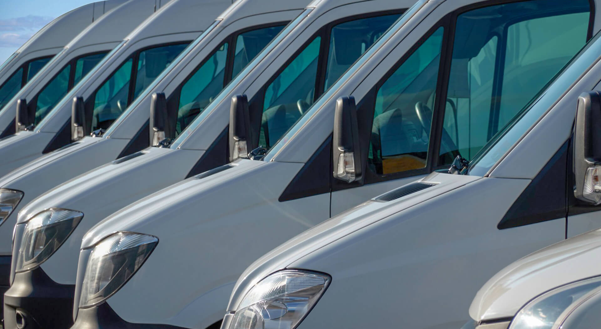white transport vans are waiting for the next order