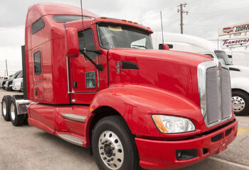 Kenworth T680 high-roof sleeper semi trailer truck at the dealership