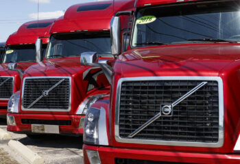 red Volvo trucks lined up for sale