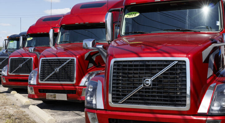 red Volvo trucks lined up for sale